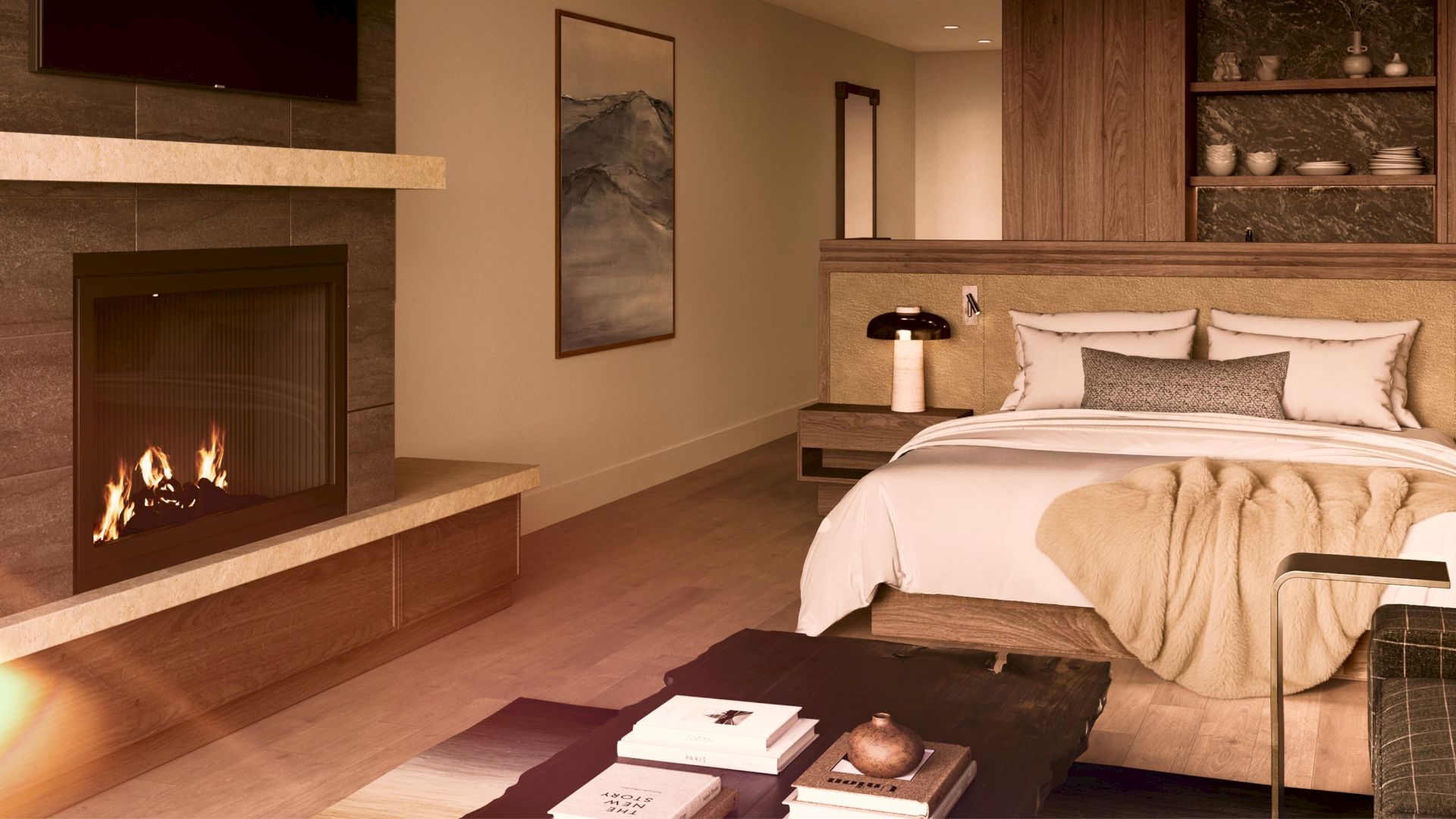A cozy hotel room with a fireplace, king bed, warm lighting, and a contemporary, tan-and-brown decor.